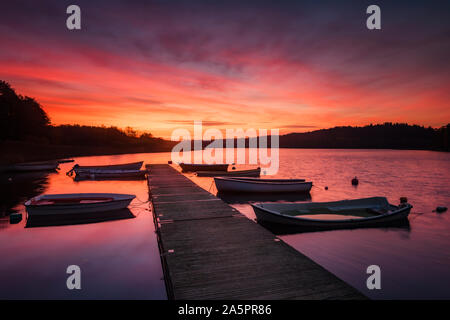 Boats moored to jetty Stock Photo