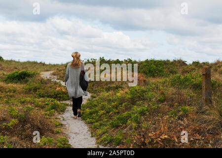 Woman walking, rear view Stock Photo
