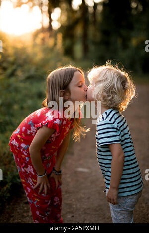 Brother and sister kissing Stock Photo