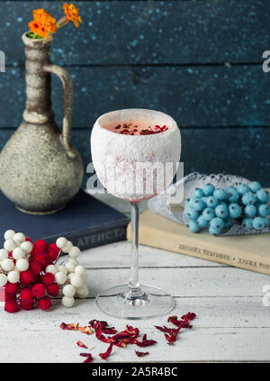 rose cocktail garnished with dried rose leaves Stock Photo