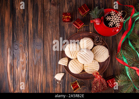 Traditional american Christmas cookies biscuits Melting Moments on wooden background.. Christmas New Year ornament decorations. top view. copy space Stock Photo