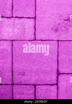 Vertical background with geometric pattern of highly detailed street pavement made of various square blocks. Textured rough surface toned in electric Stock Photo