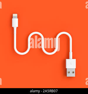 3d image render of a serpentine shaped usb cable on a coral colored background. Stock Photo