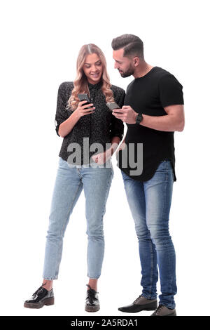 in full growth. stylish young couple with smartphones Stock Photo