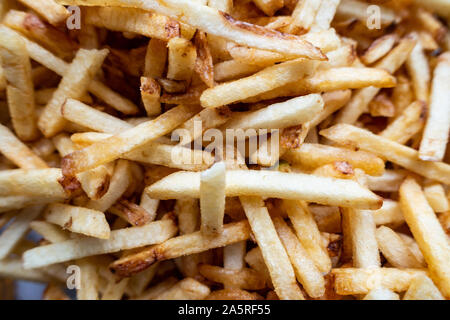 A close up view of potato chipstick style crisps. Stock Photo
