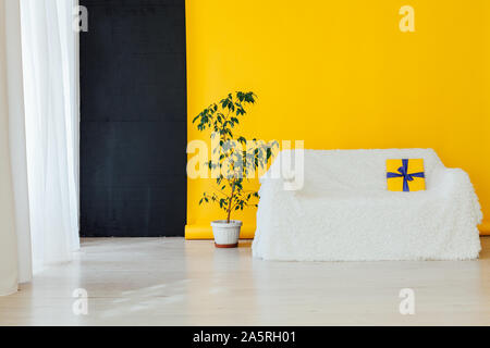 white sofa in the interior of the room with a yellow background Stock Photo
