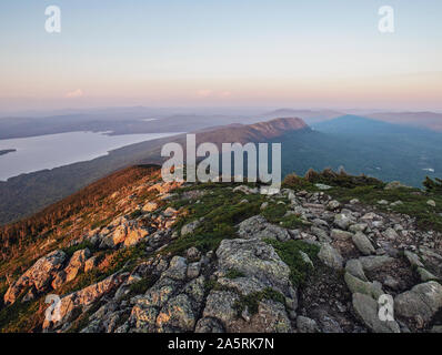 The sun sets on the Appalachian Trail over mountains and lakes, Maine. Stock Photo