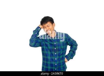 The Asian man in blue plaid shirt is scratching his head because of headache. Stock Photo