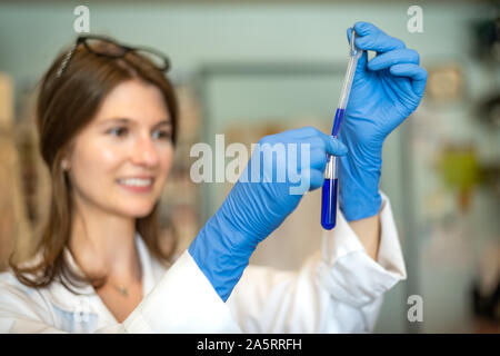 Woman in science: woman researcher working in biomedical research laboratory Stock Photo