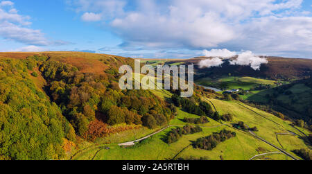 Early Autumn morning in Wales UK, with clouds forming and rising from a lake