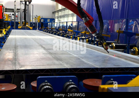 Robotic welding complex in the production workshop factory for the  manufacturing of modern rail transport and locomotives. Weld seam tracker, roboter Stock Photo