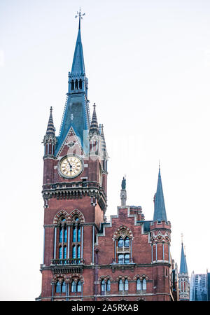 Ornate Victorian Gothic architecture clock spire, St Pancras railway station, London, England, UK Stock Photo