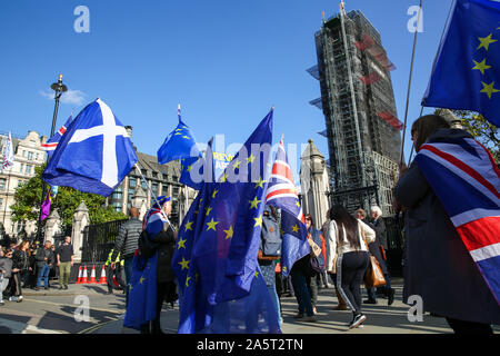London, UK. 22nd Oct, 2019. Anti-Brexit protesters with European Union flags outside the Houses of Parliament, Westminster. London MPs debate British Prime Minister Boris Johnson's Brexit Bill. Credit: SOPA Images Limited/Alamy Live News