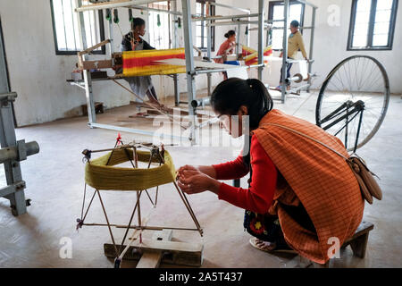 Woman on spinning wheel in Umsolaith village, Khasi Hills, Meghalaya, India, Asia Stock Photo