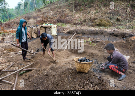 Production of charcoal at the village of Umsolaith, Khasi Hills - St. Francis Eco-Spirituality Center in Orlong Hada, Meghalaya state, India, Asia Stock Photo