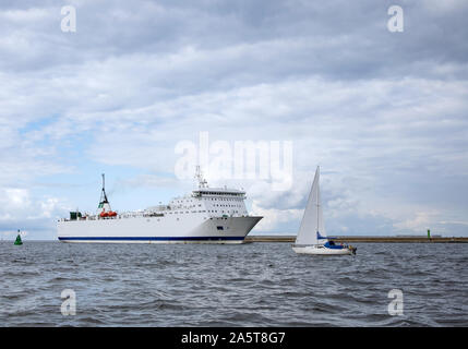 merchant ship entering the Baltic port in Poland Stock Photo