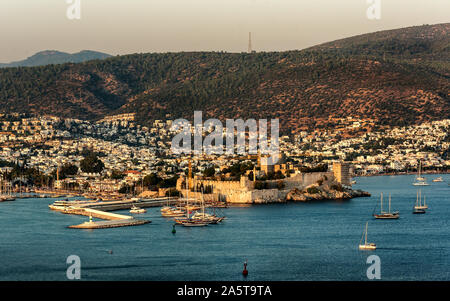 Panoramic Sunset view of Bodrum Castle and marina bay on Turkish Riviera. Bodrum is a district and a port city in Mugla Province, in the southwestern Stock Photo