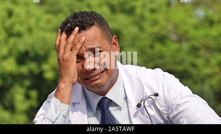 Sad Handsome Male Doctor Wearing Lab Coat Stock Photo