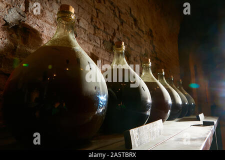 Vintage wine bottles in cellar. Shallow dof. Stock Photo