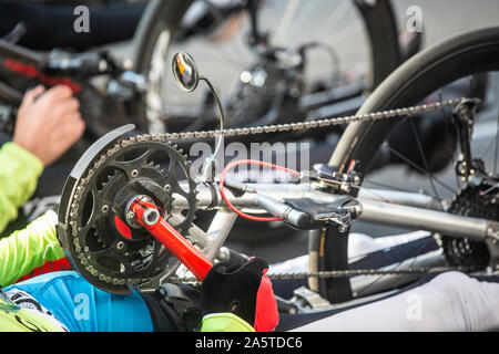 Disabled athlete in a sport wheelchair during marathon run, disabled people professional sports. Stock Photo