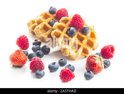 Waffles with blueberries and raspberries isolated on white background. Stock Photo