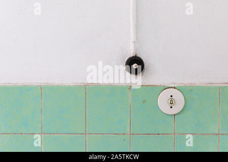 Vintage toggles for Licht which means light in German and bell on wall Stock Photo