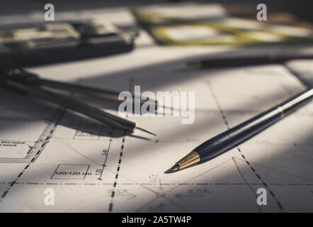 Architect design. Sketch, plans blueprints. Pencil, dividers, ruler. Sunlight on the blueprint. Architecture concept. Stock Photo