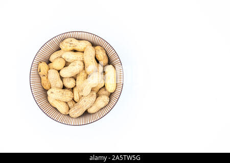peanuts in shells in a bowl isolated on white background Stock Photo