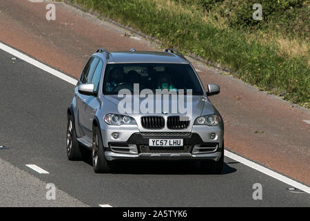 2007 silver BMW X5 SE 7S 3.0d Auto; Vehicle travelling on the M6 motorway near Preston in Lancashire, UK Stock Photo