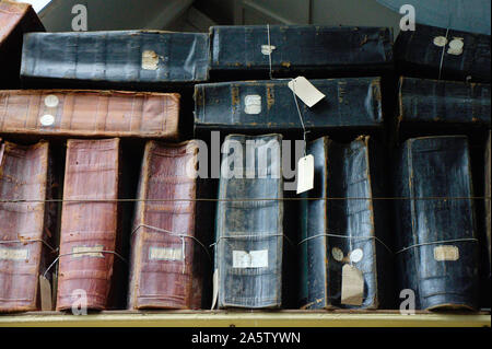 Accounting. Old stock-books on a shelf in an English 19th century textile factory. Stock Photo