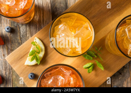 Cool Refreshing Flavored Berry Iced Teas with Lemon and Mint Stock Photo