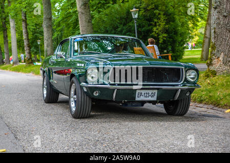 BADEN BADEN, GERMANY - JULY 2019: dark green FORD MUSTANG coupe first generation 1964 1973, oldtimer meeting in Kurpark. Stock Photo