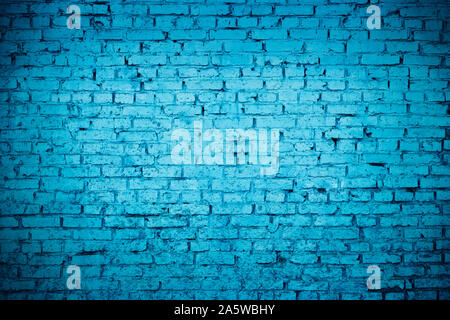 old red brick Brick wall painted with deep blue paint Stock Photo