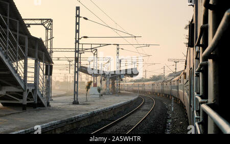 Slowly passing through,looking from a glassless 2nd class sleeper carriage window on a journey from Mysore to Pondicherry. Stock Photo