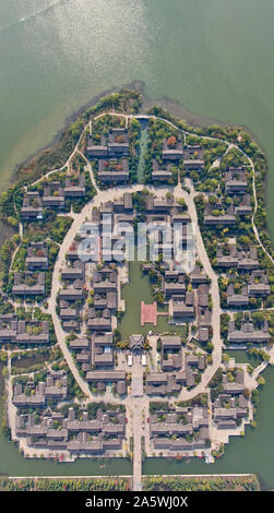 Jiangsu, Jiangsu, China. 23rd Oct, 2019. Jiangsu, CHINA-Aerial photo taken on Oct. 20, 2019 shows the beautiful autumn colors of Pananhu national wetland park in Xuzhou, east China'sJiangsu province.As the first wetland park for ecological restoration of coal mine subsidence area in China, Pan 'an lake national wetland park was once the largest and most serious coal mining subsidence area in Xuzhou. Credit: SIPA Asia/ZUMA Wire/Alamy Live News Stock Photo