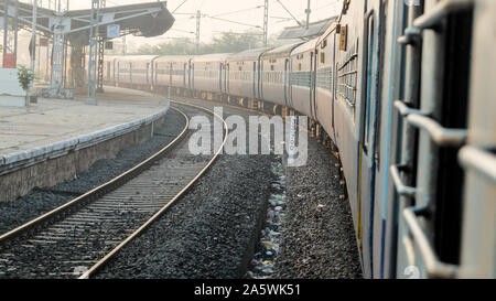 Slowly passing through,looking from a glassless 2nd class sleeper carriage window on a journey from Mysore to Pondicherry. Stock Photo