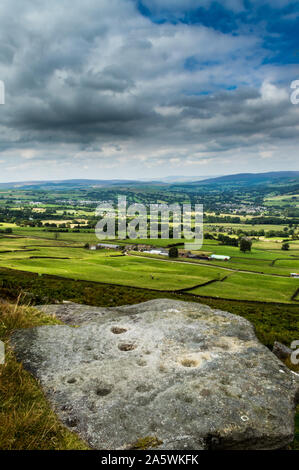 Prehistoric cup and ring mark carved stone rock art outcrop at ...