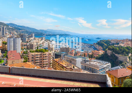 View of the Mediterranean Sea, and the marina, port, city and rock of Monte Carlo, Monaco from a terrace high on a hill Stock Photo