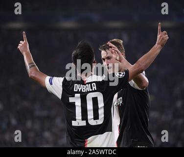 Turin, Italy. 22nd Oct, 2019. Juventus' Paulo Dybala (L) celebrates during the UEFA Champions League Group D soccer match between FC Juventus and Lokomotiv Moscow in Turin, Italy, Oct. 22, 2019. Credit: Alberto Lingria/Xinhua/Alamy Live News Stock Photo