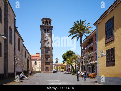 San Cristobal de La Laguna, Tenerife, Spain - April 29, 2019: Street of La Laguna old town with the tower of Church of the Immaculate Conception. Stock Photo