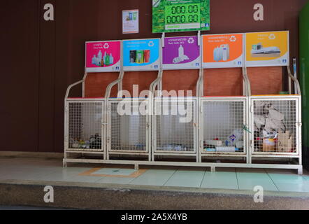 Bangkok, Thailand - October 20 2019 : Closeup recycle bins with information signs used for waste sorting. Glass bottles, plastic  bottles, aluminium c Stock Photo