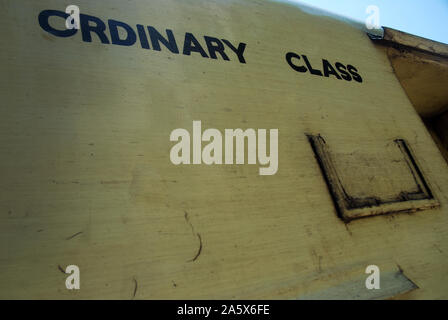 Passengers aboard a train in Yangon, Myanmar. Stock Photo