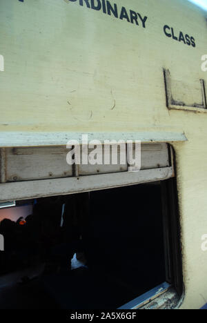 Passengers aboard a train in Yangon, Myanmar. Stock Photo