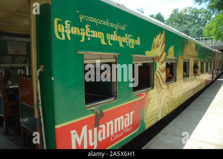 Passengers aboard a train in Yangon, Myanmar. Stock Photo