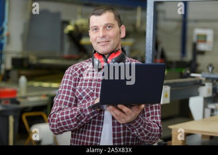 male engineer using on laptop Stock Photo
