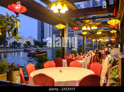 Singapore-05 APR 2018: Singapore Clarke Quay night view from riverfront restaurant Stock Photo