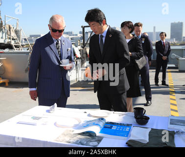 The Prince of Wales talks with representatives of groups tackling ocean plastics and climate change during a visit to HMS Enterprise, which is moored at Harumi Pier in Tokyo, Japan. Stock Photo