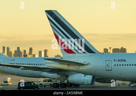 Tail of Air France Boeing 777-3 (F-GZNL) while at a gate during sunset at Toronto Pearson Intl. Airport. Stock Photo