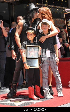 LOS ANGELES, CA. July 10, 2012: Rock guitarist Slash & sons & wife Perla Ferrar on Hollywood Blvd where he was honored with a star on the Hollywood Walk of Fame. © 2012 Paul Smith / Featureflash Stock Photo