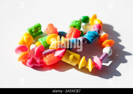 a colorful child's necklace on white background Stock Photo